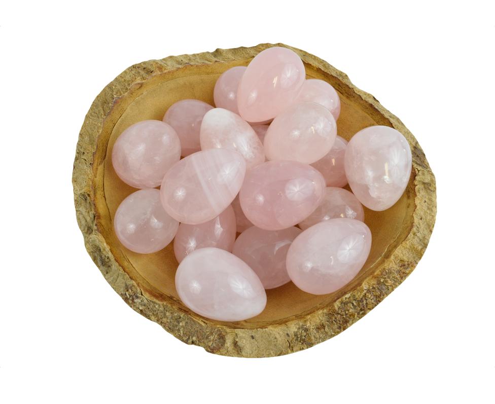 Bowl of Rose Quartz Yoni Eggs to show the color variation between stones